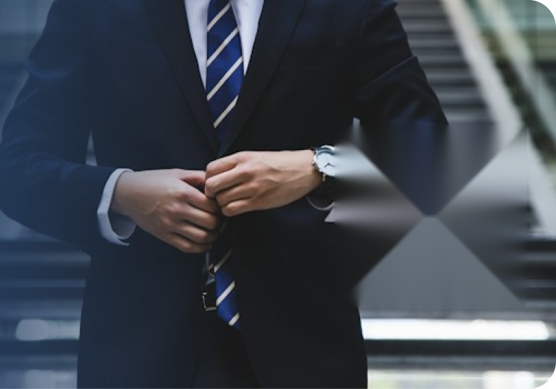 Medicare insurance agent in a suit and tie buttoning his jacket