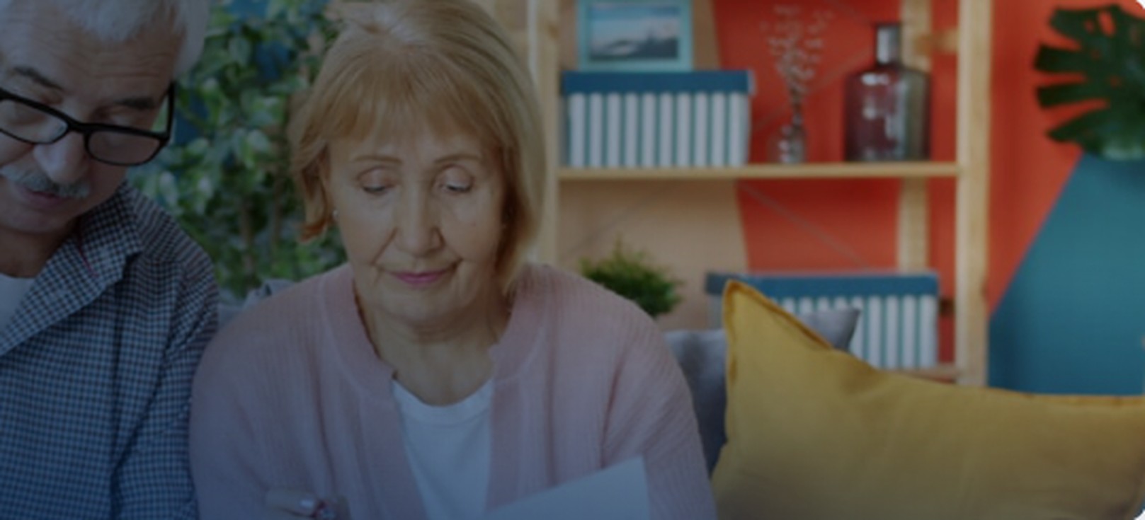 Elderly couple reviewing Medicare documents at home