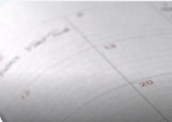 Close-up of a calendar marking Medicare enrollment dates